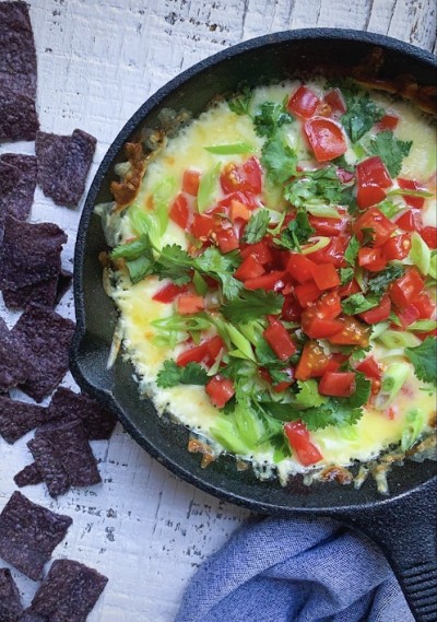 Skillet Queso Fundido with Fresh Tomatoes and Cilantro